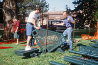 Two Men Assembling Central Park Playground Equipment