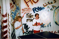 Two Girls Playing Ping Pong at The Limit