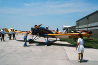 People Starting a Propeller Plane