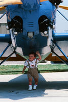 Child Under a Propeller Plane