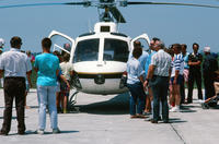 Group of People Around a Helicopter