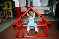 Two Children Playing on Climbing Frame