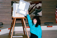 Woman Presenting Grinnell Logo Idea