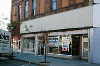 Storefront with Critchett's Piano Ads