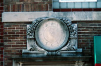 Stone Clock Over Fitness Firm Doorway