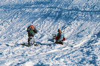 Two Children Sledding in the Snow