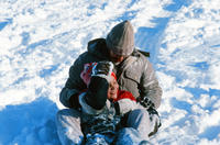 Man With Child on Sled