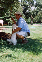 Man With Shovel and Dog