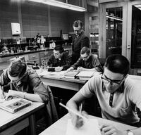 Professor Wayne Denny instructing students in a lab