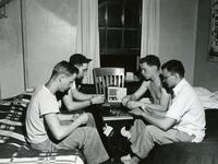 Students Play Cards in Dorm Room