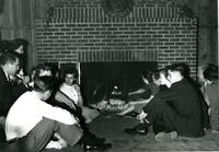 Students Gather Around Fireplace